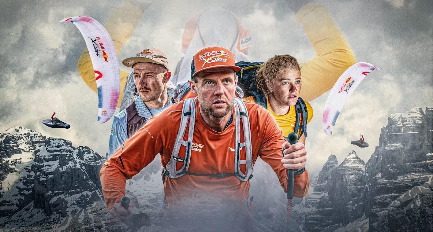 Red Bull X-Alps 2025 hero image: three athletes in race-team kit composited above a mountain ridgeline with X-Alps branded paragliders behind them.